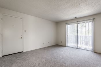 living room with door to balcony at The Timbers Apartments, Evansville, Indiana
